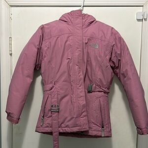 Girls large North face pink jacket with belt. In good used condition.